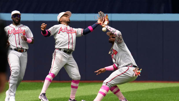 Ozzie Albies and Ronald Acuna Jr. collide while attempting to catch a ball.